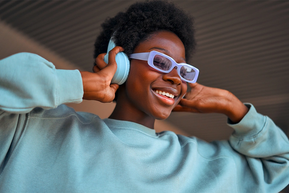 Woman listening to music and smiling