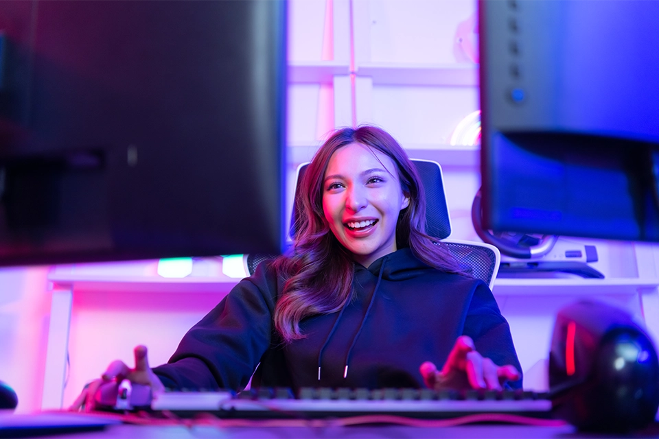 gaming content creator behind two monitors