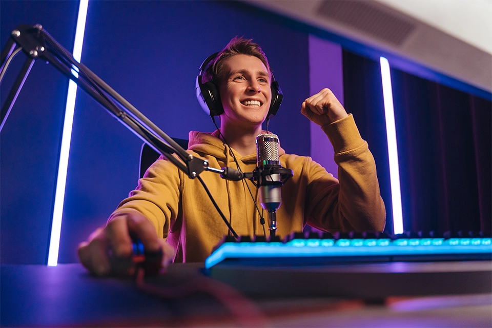Gaming content creator cheering into a mic