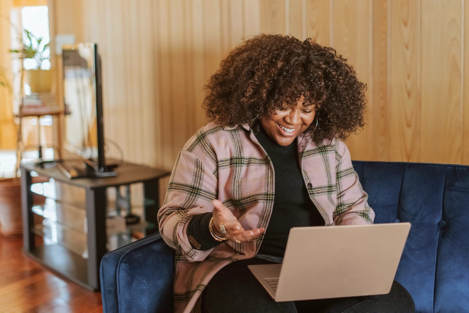 Woman surprised by an influencer marketing mistake on a laptop