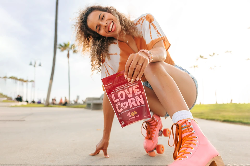 Creator on roller skates promoting a product called Love Corn