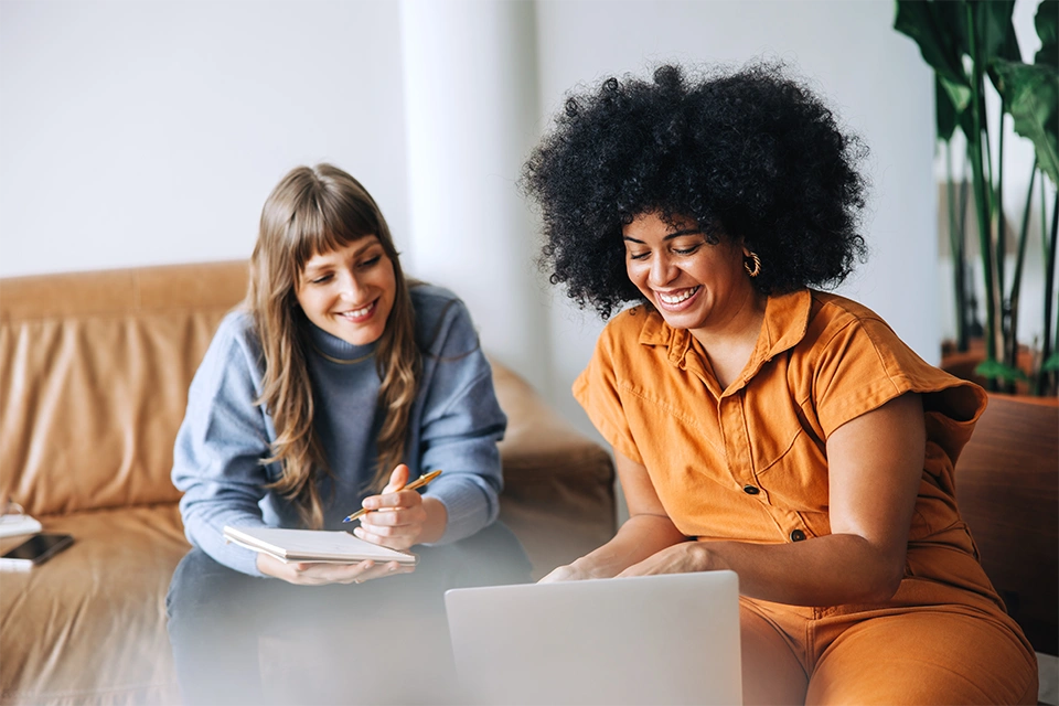 Two women talking about work