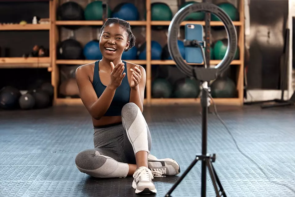 content creator making a video in front of a ring light